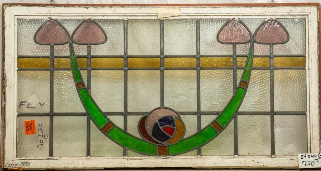 FRENCH ART NOUVEAU STAINED GLASS PANEL: French Art Nouveau stained glass panel with rose medallions, green garland motif, and pink floral accents. Approximate dimensions: h. 24", w. 44.5" Disclaimer: This is an online court ordered bankrupt