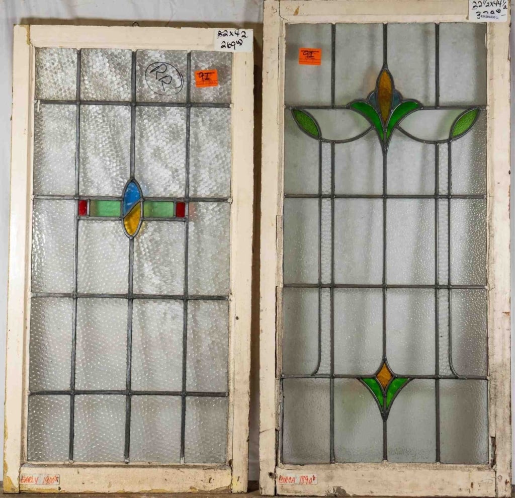 TWO ANTIQUE CONTINENTAL STAINED GLASS PANELS: Two antique Continental stained glass panels with multicolored accents. Approximate dimensions: h. 44.5", w. 22.5" Disclaimer: This is an online court ordered bankruptcy sale. Participating bidders mu
