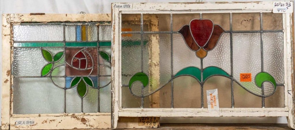 TWO FRENCH ART NOUVEAU STAINED GLASS PANELS: Two French Art Nouveau stained glass panels with floral medallions, leaf details, and amber and blue accents. Approximate dimensions: h. 20.5", w. 33" Disclaimer: This is an online court ordered bankr