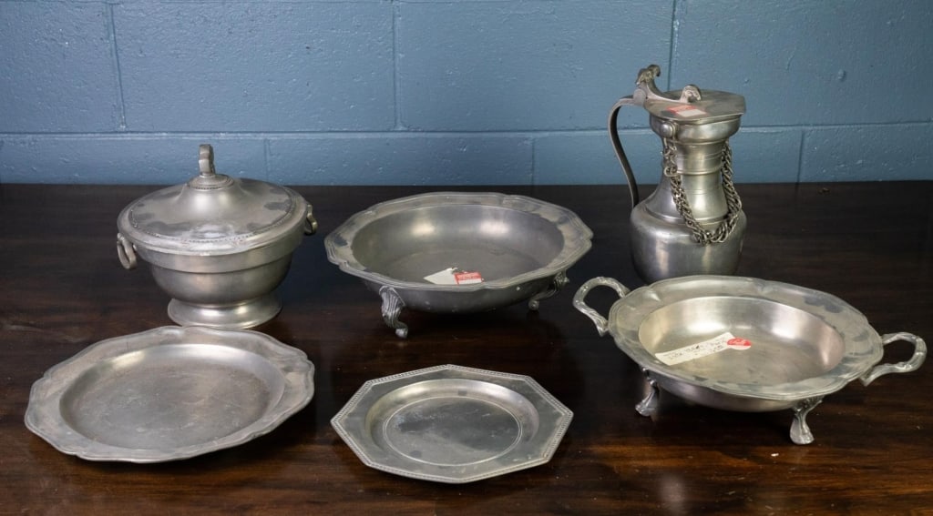 6 PEWTER TABLE ARTICLES: 6 pewter table articles, including wine jug, serving platters, and lidded serving dish. Approximate dimensions: Disclaimer: This is an online court ordered bankruptcy sale. Participating bidders must