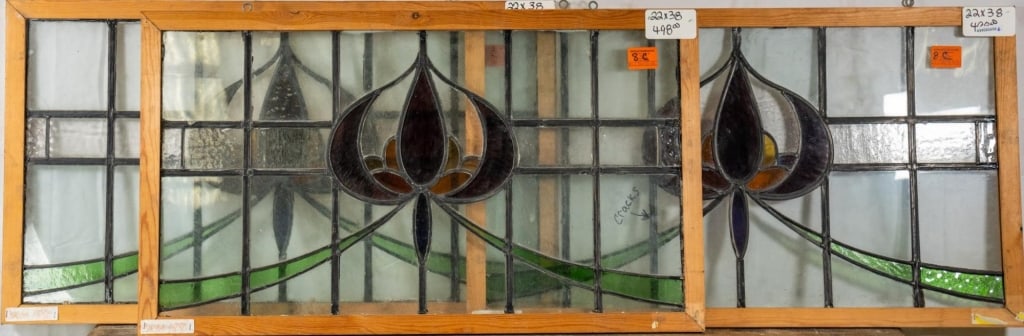 THREE FRENCH ART NOUVEAU STAINED GLASS PANELS: Three French Art Nouveau stained glass panels with purple and amber floral medallion. Approximate dimensions: h. 22", w. 38" Disclaimer: This is an online court ordered bankruptcy sale. Participating