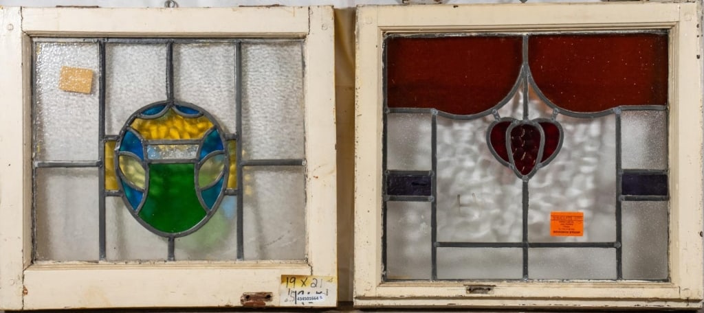 TWO ANTIQUE CONTINENTAL STAINED GLASS PANELS: Two antique Continental stained glass panels with multicolored stained glass accents. Approximate dimensions: h. 19", w. 21" Disclaimer: This is an online court ordered bankruptcy sale. Participating