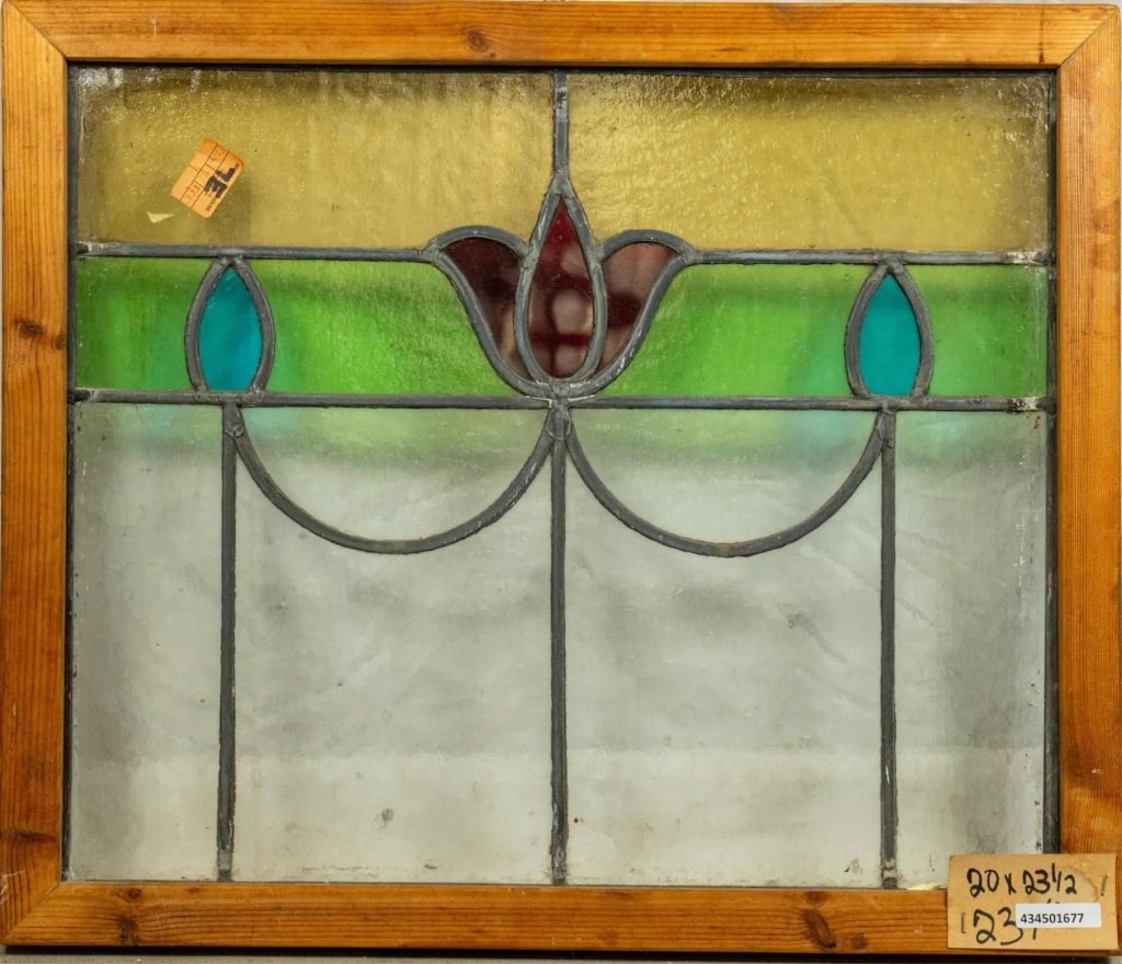 FRENCH ART NOUVEAU STAINED GLASS PANEL: French Art Nouveau stained glass panel with red tulip medallion and green, amber, and blue accents. Approximate dimensions: h. 20", w. 23.5" Disclaimer: This is an online court ordered bankruptcy sale