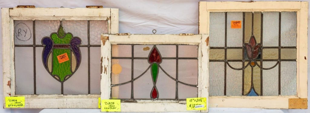 THREE FRENCH STAINED GLASS PANELS: Three French stained glass panels with floral motifs. Approximate dimensions: h. 23", w. 23" Disclaimer: This is an online court ordered bankruptcy sale. Participating bidders must have a credit card