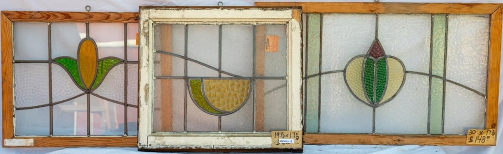 THREE FRENCH STAINED GLASS PANELS: Three French stained glass panels with floral and fruit motifs. Approximate dimensions: h. 17.5", w. 30" Disclaimer: This is an online court ordered bankruptcy sale. Participating bidders must have a