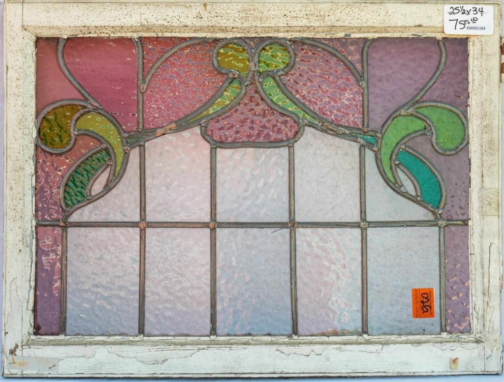 FRENCH ART NOUVEAU STAINED GLASS PANEL: French Art Nouveau stained glass panel with a green and purple floral motif. Approximate dimensions: h. 25.5", w. 34" Disclaimer: This is an online court ordered bankruptcy sale. Participating bidders