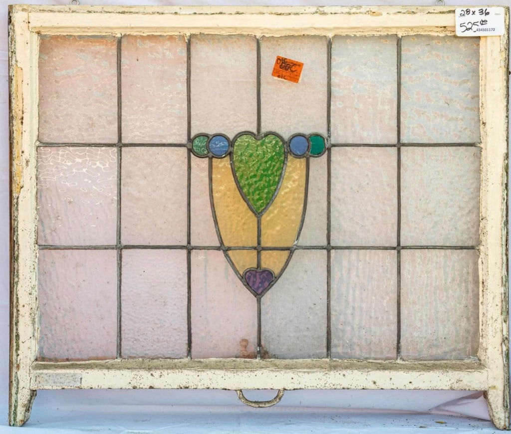 FRENCH ART NOUVEAU STAINED GLASS PANEL: French Art Nouveau stained glass panel with a central medallion in amber, green, blue, and purple. Approximate dimensions: h. 28", w. 36" Disclaimer: This is an online court ordered bankruptcy sale. P