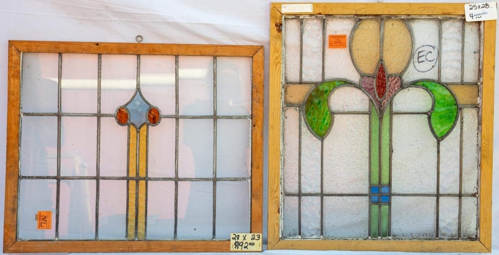 TWO CONTINENTAL STAINED GLASS PANELS: Two Continental stained glass panels, one with a floral motif and the other with abstract elements. Approximate dimensions: h. 28", w. 25" Disclaimer: This is an online court ordered bankruptcy sale.