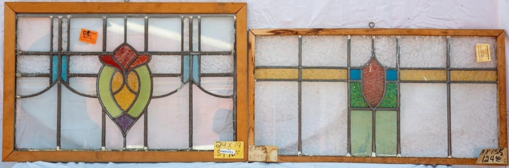 TWO FRENCH ART NOUVEAU STAINED GLASS PANELS: Two French Art Nouveau stained glass panels with multicolored glass accents, including textured and wispy glass. Approximate dimensions: h. 19", w. 29" Disclaimer: This is an online court ordered bank