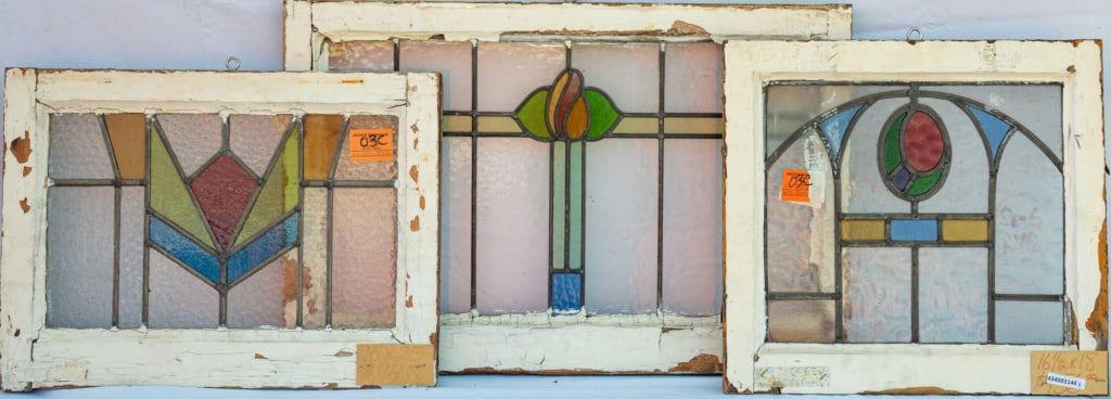 THREE FRENCH STAINED GLASS PANELS: Three French stained glass panels with multicolored stained glass elements. Approximate dimensions: h. 18", w. 24" Disclaimer: This is an online court ordered bankruptcy sale. Participating bidders mu