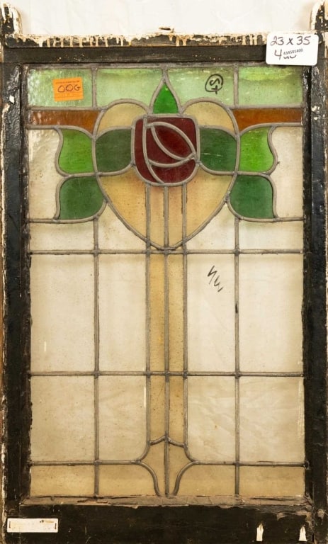 FRENCH ART NOUVEAU STAINED GLASS PANEL: French Art Nouveau stained glass panel with a heart-shaped floral medallion. Approximate dimensions: h. 35", w. 23" Disclaimer: This is an online court ordered bankruptcy sale. Participating bidders m