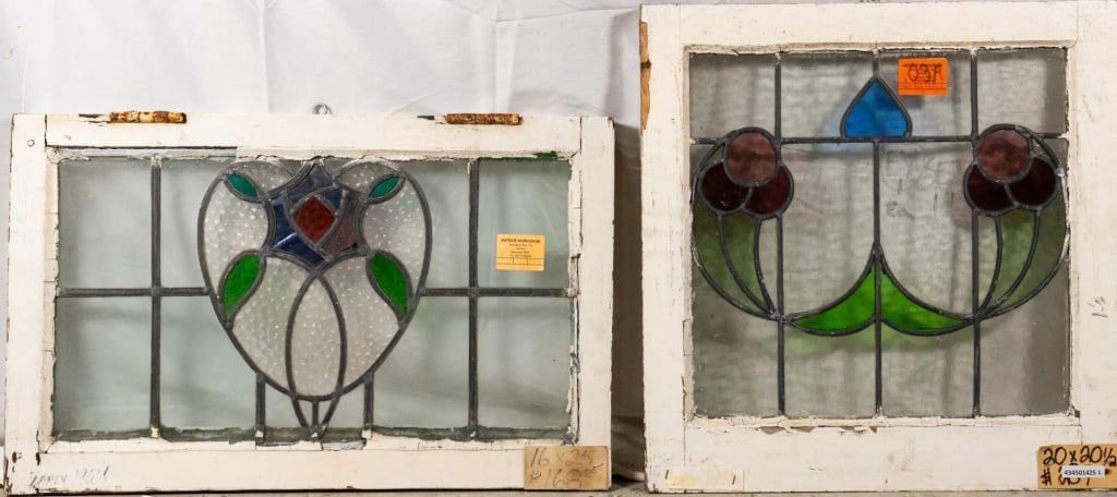 TWO CONTINENTAL STAINED GLASS PANELS: Two Continental stained glass panels with floral medallions. Approximate dimensions: h. 16", w. 25" Disclaimer: This is an online court ordered bankruptcy sale. Participating bidders must have a credi