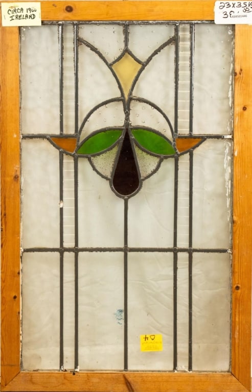 IRISH ART NOUVEAU STAINED GLASS PANEL: Irish Art Nouveau stained glass panel with floral motif. Approximate dimensions: h. 35.5", w. 23" Disclaimer: This is an online court ordered bankruptcy sale. Participating bidders must have a credit