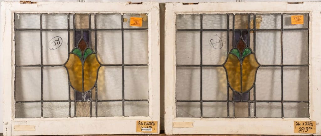 PAIR OF CONTINENTAL STAINED GLASS PANELS: Pair of Continental stained glass panels with shield-shaped medallions and colorless leaded glass panels. Approximate dimensions: h. 26", w. 22.5" Disclaimer: This is an online court ordered bankruptc