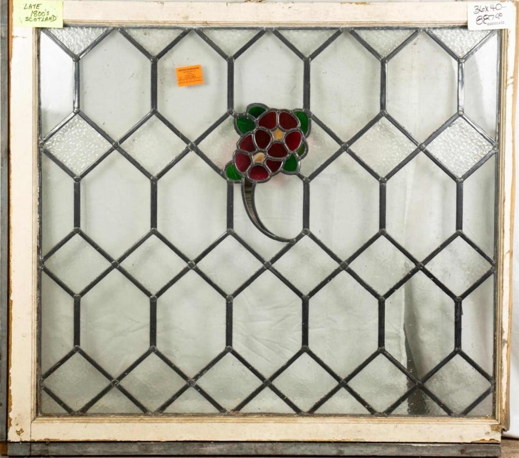 ENGLISH ART NOUVEAU STAINED GLASS PANEL: English Art Nouveau stained glass panel, with rose and leaf medallion, set within colorless leaded glass. Approximate dimensions: h. 36", w. 40" Disclaimer: This is an online court ordered bankruptcy