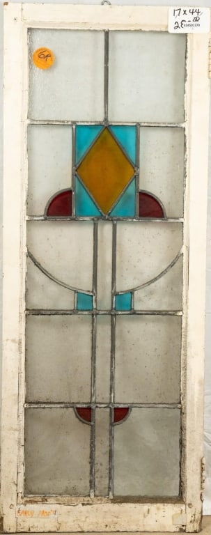 ENGLISH ART DECO STAINED GLASS PANEL: English Art Deco stained glass panel with blue and canary yellow geometric medallion, and blue and red stained glass accents. Approximate dimensions: h. 44", w. 17" Disclaimer: This is an online court