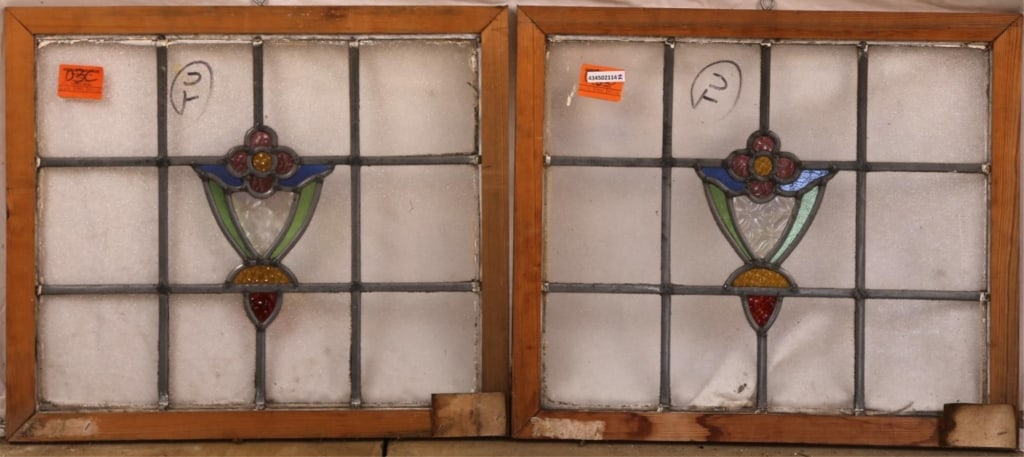 PAIR OF CONTINENTAL STAINED GLASS PANELS: Pair of Continental stained glass panels with floral medallions and textured stained glass accents. Approximate dimensions: h. 23", w. 25" Disclaimer: This is an online court ordered bankruptcy sale. 