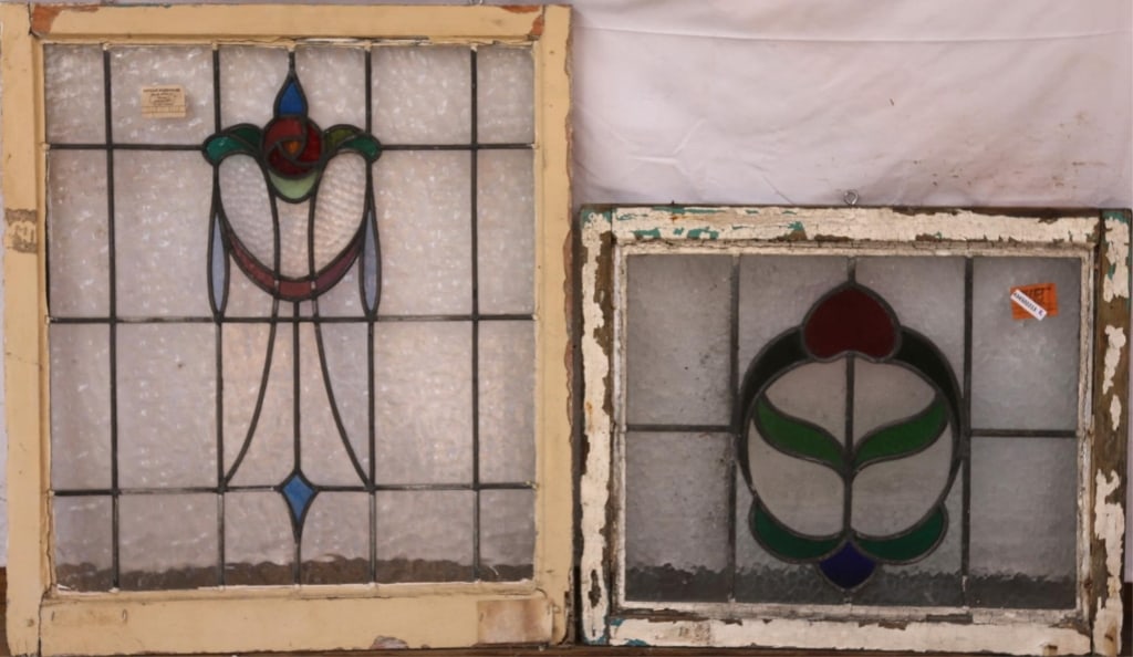 TWO ANTIQUE CONTINENTAL STAINED GLASS PANELS: Two antique Continental stained glass panels, one with a floral medallion and garland motif, the other with an abstract floral medallion Approximate dimensions: h. 30", w. 26" Disclaimer: This is an o
