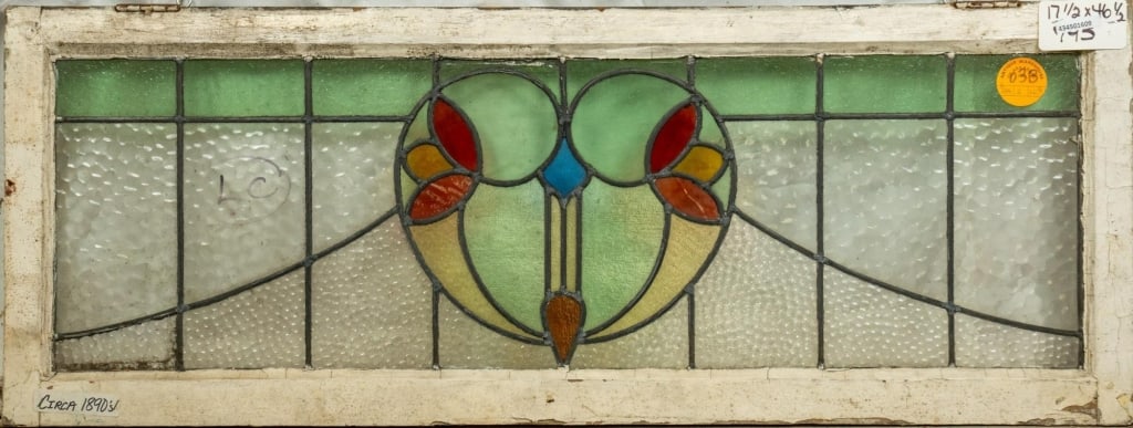 FRENCH ART NOUVEAU STAINED GLASS PANEL: French Art Nouveau stained glass panel with heart-shaped floral medallion. Approximate dimensions: h. 17.5", w. 46.5" Disclaimer: This is an online court ordered bankruptcy sale. Participating bidders