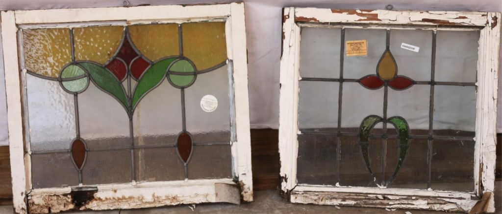 TWO ANTIQUE CONTINENTAL STAINED GLASS PANELS: Two antique Continental stained glass panels with floral medallions and green, canary, and blue stained glass accents. Approximate dimensions: h. 20.5", w. 23.75" Disclaimer: This is an online court o