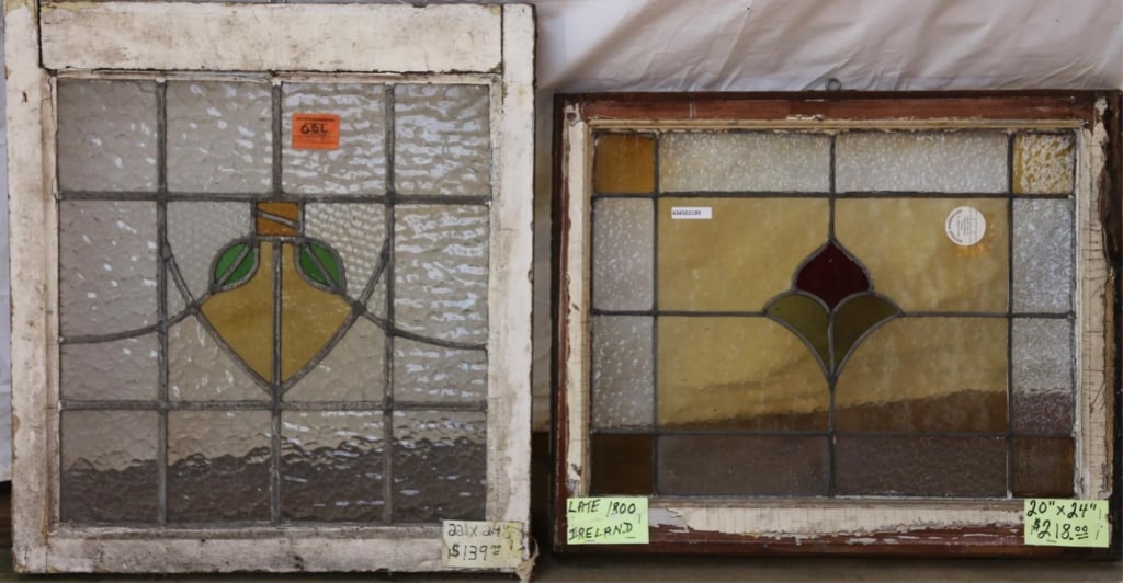 TWO ANTIQUE CONTINENTAL STAINED GLASS PANELS: Two antique Continental stained glass panels with floral medallions and amber and textured leaded glass. Approximate dimensions: h. 22", w. 24" Disclaimer: This is an online court ordered bankruptcy s