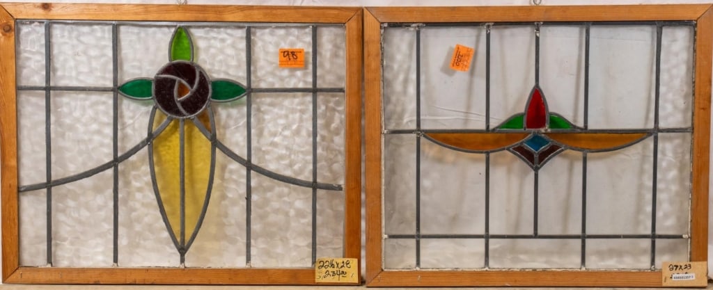 TWO FRENCH STAINED GLASS PANELS: Two French stained glass panels with floral and geometric motifs. Approximate dimensions: h. 27", w. 29" Disclaimer: This is an online court ordered bankruptcy sale. Participating bidders must have a