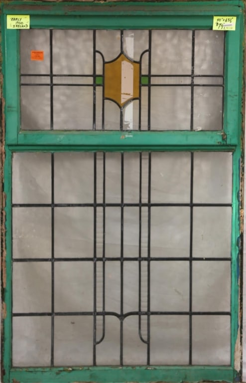 IRISH ART DECO STAINED GLASS PANEL: Irish Art Deco stained glass panel with shield-form medallion. Approximate dimensions: h. 63.5", w. 40" Disclaimer: This is an online court ordered bankruptcy sale. Participating bidders must have a c