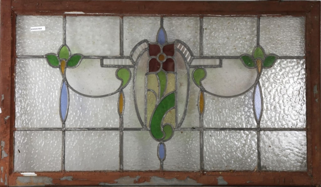 FRENCH ART NOUVEAU STAINED GLASS PANEL: French Art Nouveau stained glass panel with a central floral medallion and symmetrical floral accents to the sides. Approximate dimensions: h. 24", w. 40" Disclaimer: This is an online court ordered b