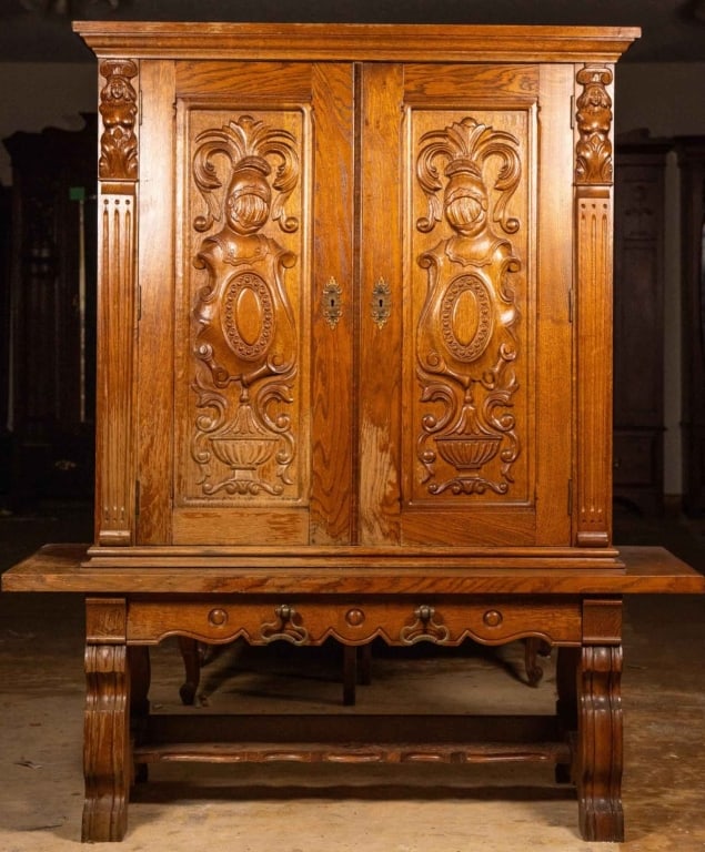 ENGLISH CARVED OAK CABINET: English carved oak cabinet with inset carved panels and stretcher base. Approximate dimensions: h. 62", w. 53", d. 21" Disclaimer: This is an online court ordered bankruptcy sale. Participating bidder