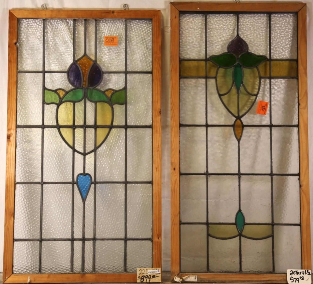 TWO FRENCH ART NOUVEAU STAINED GLASS PANELS: Two French Art Nouveau stained glass panels with heart-shaped floral motif medallions. Approximate dimensions: h. 41.5", w. 20" Disclaimer: This is an online court ordered bankruptcy sale. Participati
