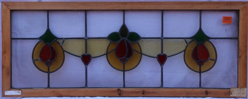 ANTIQUE STAINED GLASS WINDOW: Antique stained glass window. Approximate dimensions: h. 21", w. 53" Disclaimer: This is an online court ordered bankruptcy sale. Participating bidders must have a credit card on file with Live Auctio