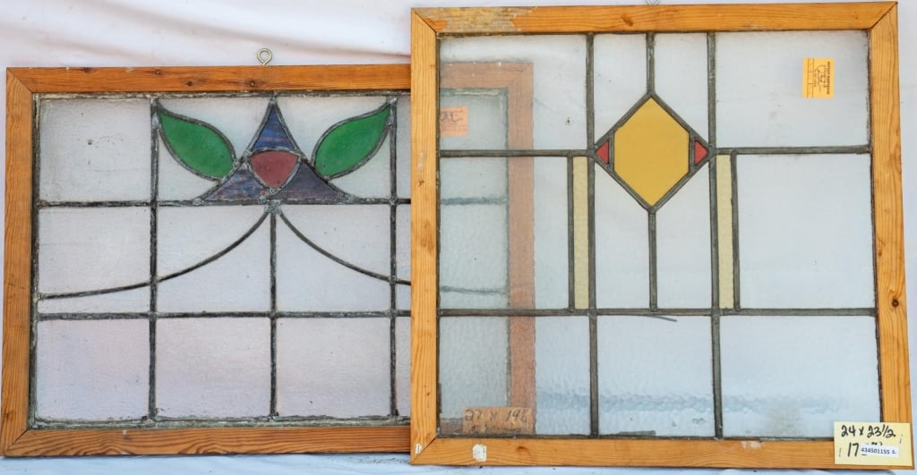 TWO CONTINENTAL STAINED GLASS PANELS: Two Continental stained glass panels with multicolored glass elements. Approximate dimensions: h. 24", w. 23.5" Disclaimer: This is an online court ordered bankruptcy sale. Participating bidders must