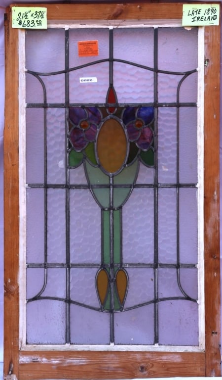 ANTIQUE STAINED GLASS WINDOW: Antique jeweled stained glass window. Approximate dimensions: h. 21.5", w. 37.5" Disclaimer: This is an online court ordered bankruptcy sale. Participating bidders must have a credit card on file with