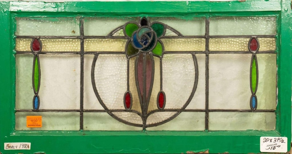 FRENCH ART NOUVEAU STAINED GLASS PANEL: French Art Nouveau stained glass panel with a blue rose medallion and leaves. Approximate dimensions: h. 20", w. 38.5" Disclaimer: This is an online court ordered bankruptcy sale. Participating bidder
