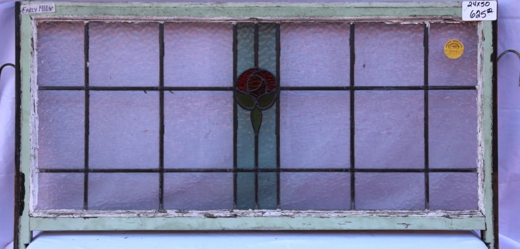 ANTIQUE STAINED GLASS WINDOW: Antique stained glass window. Approximate dimensions: h. 24", w. 50" Disclaimer: This is an online court ordered bankruptcy sale. Participating bidders must have a credit card on file with Live Auctio