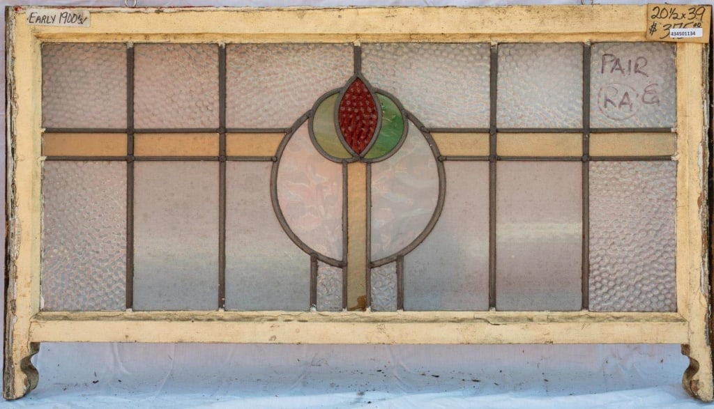 FRENCH ART NOUVEAU STAINED GLASS PANEL: French Art Nouveau stained glass panel with a central red and green floral medallion. Approximate dimensions: h. 20.5", w. 39" Disclaimer: This is an online court ordered bankruptcy sale. Participatin
