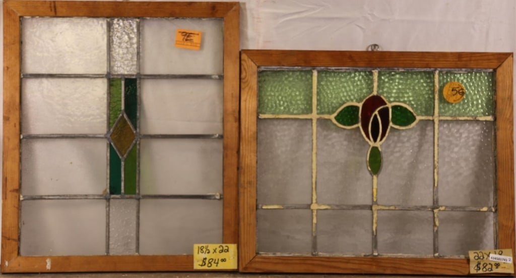 TWO ANTIQUE CONTINENTAL STAINED GLASS PANELS: Two antique Continental stained glass panels, one with geometric medallion and the other with floral medallion. Approximate dimensions: h. 22", w. 18.5" Disclaimer: This is an online court ordered ban