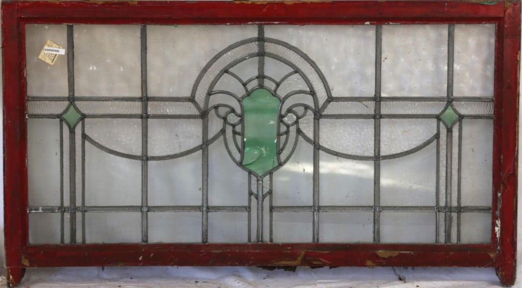 ANTIQUE CONTINENTAL STAINED GLASS PANEL: Antique Continental stained glass panel with a green abstract medallion and two green rhombic accents to the sides. Approximate dimensions: h. 28", w. 45.5" Disclaimer: This is an online court ordered