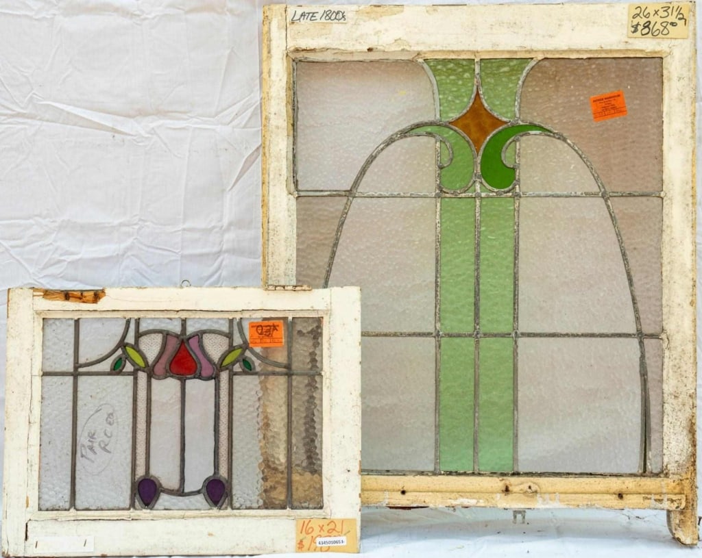 TWO CONTINENTAL STAINED GLASS PANELS: Two Continental stained glass panels with abstract multicolored stained glass details. Approximate dimensions: h. 31.5", w. 26" Disclaimer: This is an online court ordered bankruptcy sale. Participati