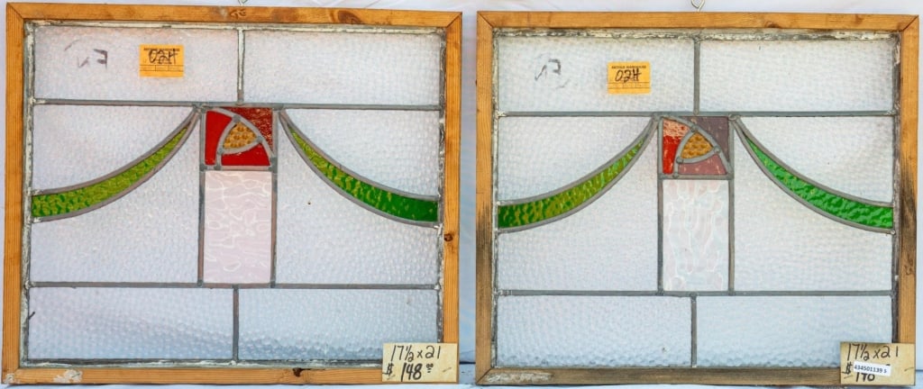 PAIR OF FRENCH ART NOUVEAU STAINED GLASS PANELS: Pair of French Art Nouveau stained glass panels with a square red and canary floral medallion and green ribbon accents. Approximate dimensions: h. 17.5", w. 21" Disclaimer: This is an online court ord