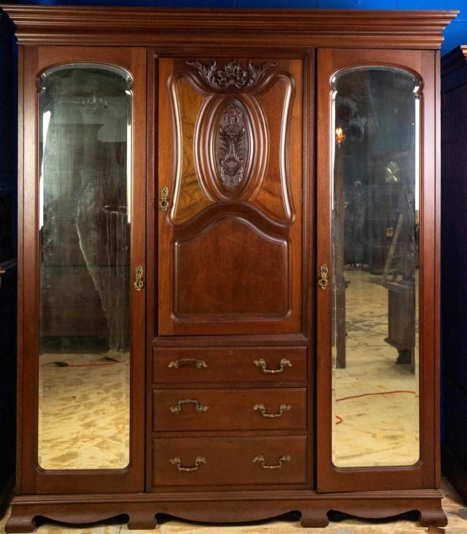 FRENCH MAHOGANY CHIFFOROBE: French mahogany chifforobe with beveled mirrors and inset carved panels. Approximate dimensions: h. 84.5", w. 69.5", d. 21" Disclaimer: This is an online court ordered bankruptcy sale. Participating b