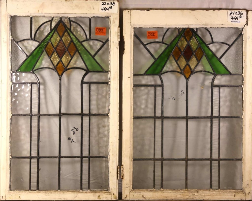TWO ANTIQUE ART DECO STAINED GLASS PANELS: Two antique Art Deco stained glass panels with rhombic and triangular design. Approximate dimensions: h. 38", w. 22" Disclaimer: This is an online court ordered bankruptcy sale. Participating bidders