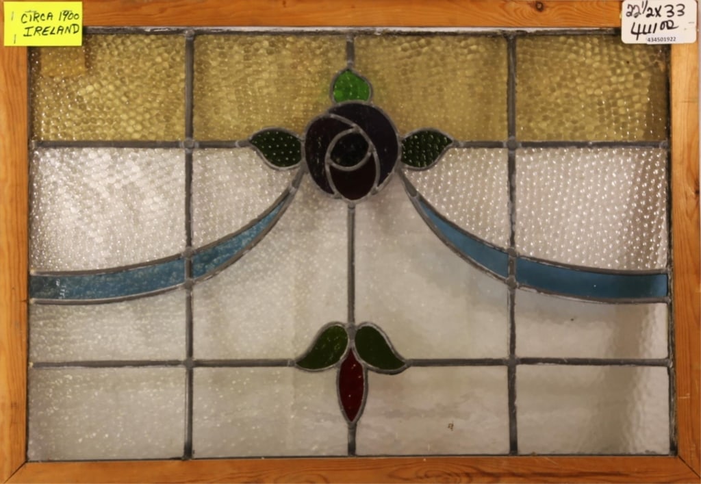 FRENCH ART NOUVEAU STAINED GLASS PANEL: French Art Nouveau stained glass panel with blue flower medallion and blue ribbon accents. Approximate dimensions: h. 22.5", w. 33" Disclaimer: This is an online court ordered bankruptcy sale. Partici