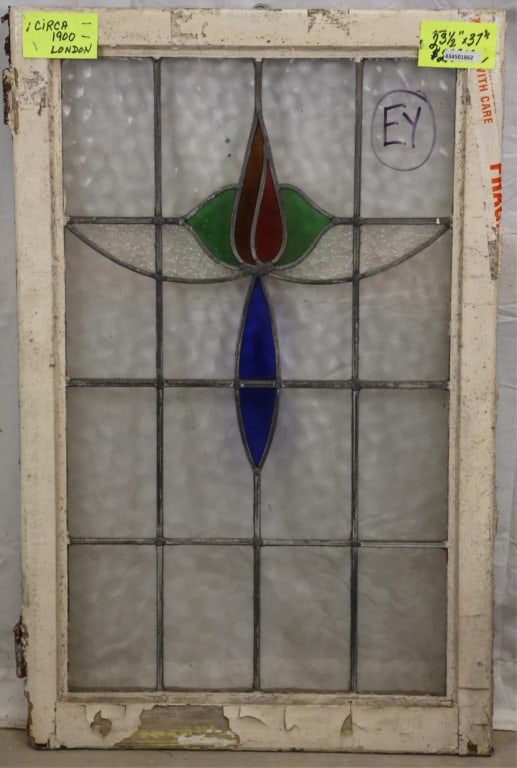 ANTIQUE ENGLISH STAINED GLASS PANEL: Antique English stained glass panel with floral medallion. Approximate dimensions: h. 37", w. 23.5" Disclaimer: This is an online court ordered bankruptcy sale. Participating bidders must have a credi