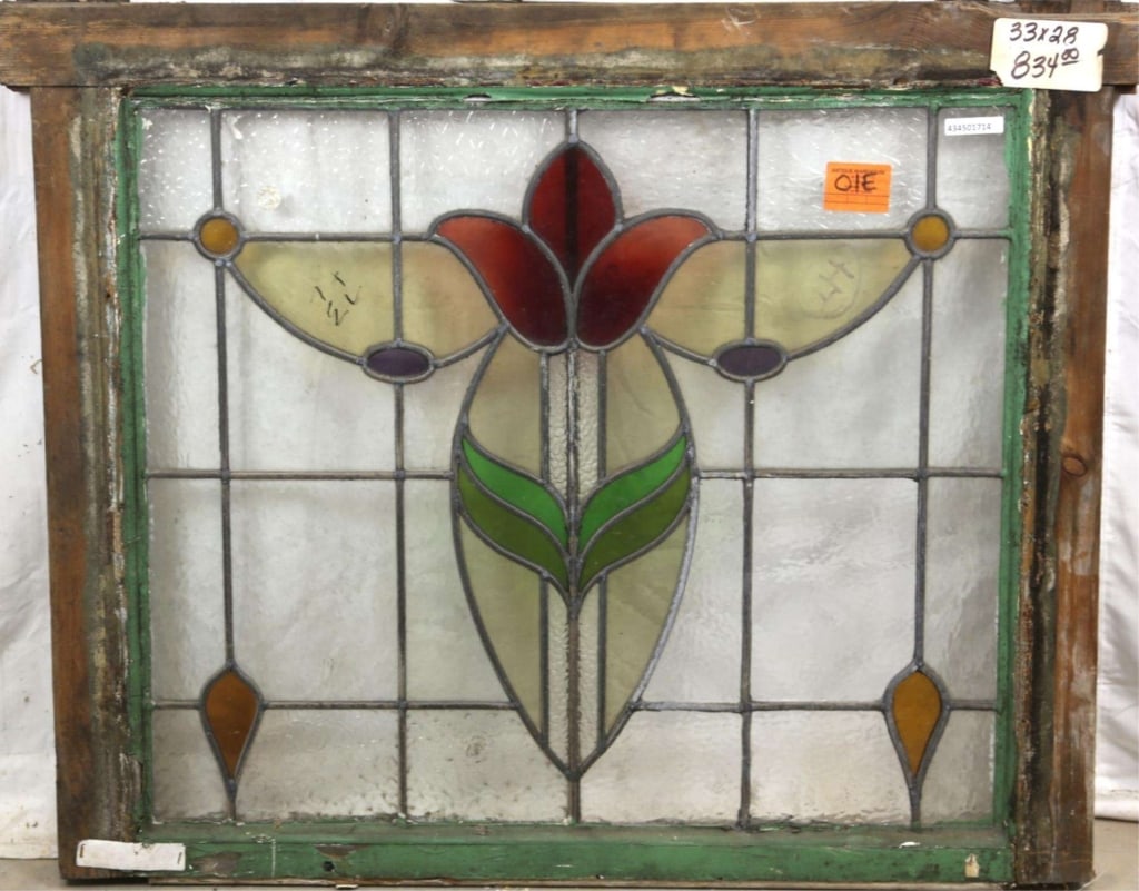 FRENCH ART NOUVEAU STAINED GLASS PANEL: French Art Nouveau stained glass panel with red flower medallion, leaf details, and amber and purple accents. Approximate dimensions: h. 28", w. 33" Disclaimer: This is an online court ordered bankrup