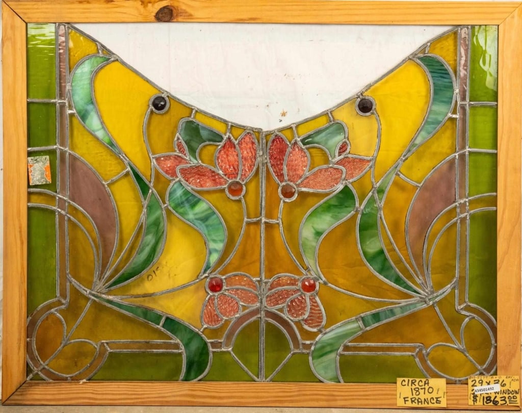 FRENCH ART NOUVEAU STAINED JEWELED GLASS PANEL: French Art Nouveau stained jeweled glass panel decorated with textured floral motif details and six jeweled elements. Approximate dimensions: h. 29", w. 36" Disclaimer: This is an online court ordered