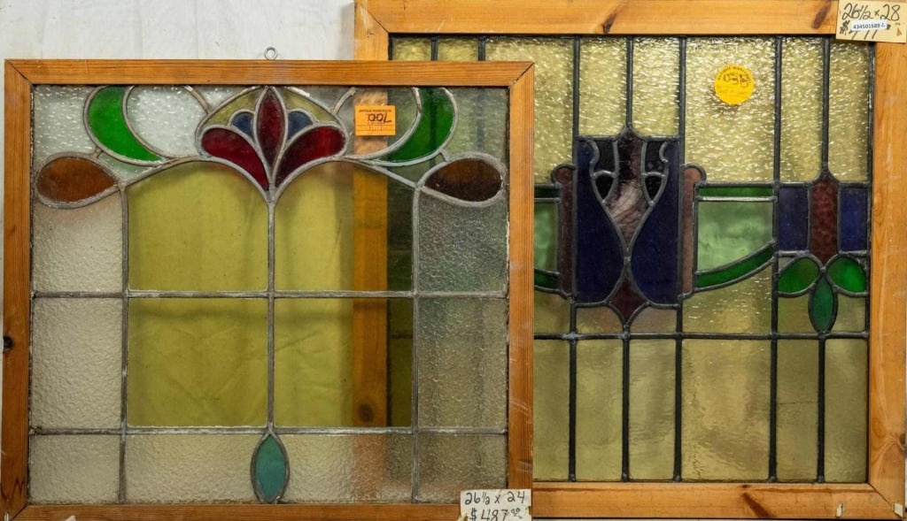 TWO FRENCH ART NOUVEAU STAINED GLASS PANELS: Two French Art Nouveau stained glass panels with wispy and textured glass accents. Approximate dimensions: h. 26.5", w. 28" Disclaimer: This is an online court ordered bankruptcy sale. Participating b