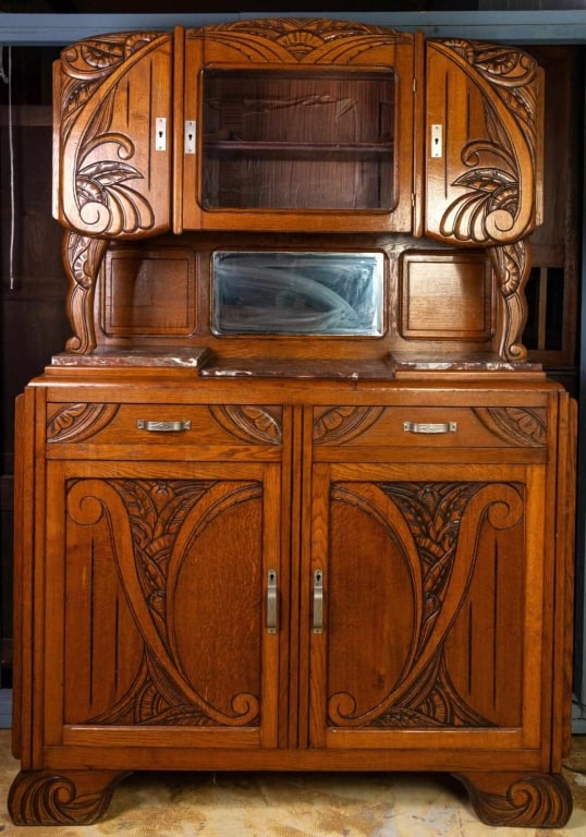 FRENCH ART NOUVEAU VITRINE SERVER: French Art Nouveau vitrine server with beveled glass backsplash, marble top, inset carved panels, and elaborate carving throughout. Approximate dimensions: h. 77", w. 52", d. 17" Disclaimer: This is a