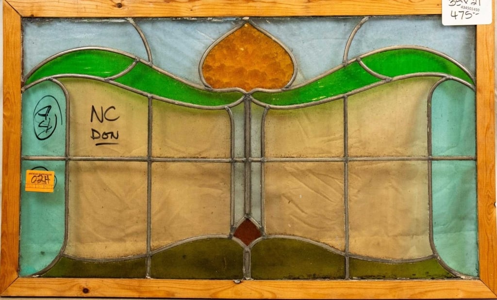 CONTINENTAL ART NOUVEAU STAINED GLASS PANEL: Continental Art Nouveau stained glass panel with multicolored accents, some textured. Approximate dimensions: h. 21", w. 35" Disclaimer: This is an online court ordered bankruptcy sale. Participating
