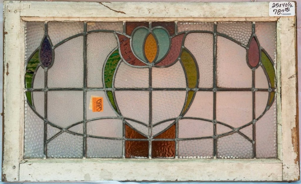 FRENCH ART NOUVEAU STAINED GLASS PANEL: French Art Nouveau stained glass panel with a floral motif and textured leaded glass panels. Approximate dimensions: h. 25", w. 40.5" Disclaimer: This is an online court ordered bankruptcy sale. Parti